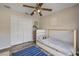 A cozy bedroom features a unique bed design, stylish flooring, a ceiling fan, and closet at 1880 1St Ave, Deland, FL 32724