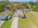 Charming single-Gathering home with a well-manicured lawn, solar panels, and attached two-car garage at 1880 1St Ave, Deland, FL 32724
