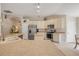 Open kitchen featuring an island, stainless steel appliances, and an adjacent pantry at 1880 1St Ave, Deland, FL 32724