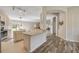 Open-concept kitchen with bar seating overlooking dining area and living spaces at 1880 1St Ave, Deland, FL 32724