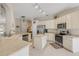 Bright kitchen with stainless steel appliances, center island, and white cabinets at 1880 1St Ave, Deland, FL 32724