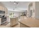 Well-lit kitchen with stainless steel appliances and a view to the living room at 1880 1St Ave, Deland, FL 32724
