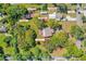 Expansive property featuring a main house, guest house, in-law house, art studio, garage, storage sheds, and a beautiful landscape at 191 Howes St, Oak Hill, FL 32759