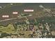 Aerial view of neighborhood homesites, parks, and a nearby beach and fishing pier at 191 Howes St, Oak Hill, FL 32759