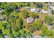 Aerial view of property featuring mature trees surrounding the homesite at 191 Howes St, Oak Hill, FL 32759