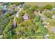 Expansive aerial view of a property with mature trees, highlighting its privacy and potential at 191 Howes St, Oak Hill, FL 32759