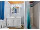 Clean bathroom with vanity, mirror, and a shower with a curtain, for basic needs at 191 Howes St, Oak Hill, FL 32759