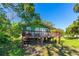 Exterior of a charming home with a wooden porch, perfect for enjoying the outdoors at 191 Howes St, Oak Hill, FL 32759