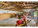 Large detached garage with room for tools, lawn equipment, and a work space at 191 Howes St, Oak Hill, FL 32759