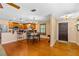 Bright kitchen area with wood cabinets, granite countertops, and an adjacent dining area at 191 Howes St, Oak Hill, FL 32759