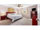Comfortable main bedroom featuring a ceiling fan and carpeted floors at 191 Howes St, Oak Hill, FL 32759