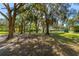 Expansive property showcasing multiple residences surrounded by mature trees and verdant lawns at 191 Howes St, Oak Hill, FL 32759
