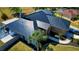 Aerial view of the home, highlighting its lush lawn and manicured landscaping in a quiet neighborhood at 1948 Spruce Creek Lndg, Port Orange, FL 32128