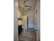 Well-lit bathroom features updated vanity, toilet, shower with stylish track lighting and wood look tile floors at 1948 Spruce Creek Lndg, Port Orange, FL 32128