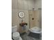 Modern bathroom featuring a clear glass shower, modern sink, and a sleek lighted mirror at 1948 Spruce Creek Lndg, Port Orange, FL 32128