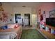 Spacious bedroom has ample closet space, wood look floors and room for storage and television at 1948 Spruce Creek Lndg, Port Orange, FL 32128