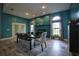 Large dining room with seating for six, blue walls, fireplace, and tile floors at 1948 Spruce Creek Lndg, Port Orange, FL 32128