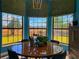 Dining room features bay windows looking out to sunny landscape at 1948 Spruce Creek Lndg, Port Orange, FL 32128