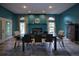 This dining room features large windows, neutral tones, and a fireplace at 1948 Spruce Creek Lndg, Port Orange, FL 32128