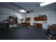 Spacious garage with built in cabinets, storage, and a work bench at 1948 Spruce Creek Lndg, Port Orange, FL 32128