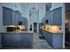 Modern kitchen with stainless steel appliances, granite countertops, and wood-look tile flooring at 1948 Spruce Creek Lndg, Port Orange, FL 32128