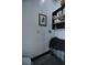 Functional laundry room with black shelving and storage at 1948 Spruce Creek Lndg, Port Orange, FL 32128