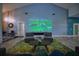 Inviting living room with a projector screen and comfortable seating, perfect for movie nights at 1948 Spruce Creek Lndg, Port Orange, FL 32128