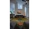Open living area with large sofa, projector screen, and abundant natural light at 1948 Spruce Creek Lndg, Port Orange, FL 32128