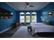 A spacious bedroom boasting a large window set, ceiling fan, and modern accents at 1948 Spruce Creek Lndg, Port Orange, FL 32128