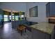 Breakfast nook adjacent to kitchen features bay windows and gray cabinets with granite countertops at 1948 Spruce Creek Lndg, Port Orange, FL 32128