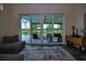 Covered patio with comfortable seating and view of the backyard at 1948 Spruce Creek Lndg, Port Orange, FL 32128