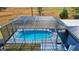 Aerial view of the screened-in pool and patio, creating a perfect outdoor entertaining space at 1948 Spruce Creek Lndg, Port Orange, FL 32128