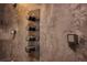 Close-up of the modern shower control panel with push button knobs at 1948 Spruce Creek Lndg, Port Orange, FL 32128