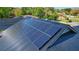 Close-up of solar panels on the home's roof, demonstrating energy efficiency and modern updates at 1948 Spruce Creek Lndg, Port Orange, FL 32128
