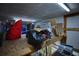 Messy storage area with items stocked on shelves at 1948 Spruce Creek Lndg, Port Orange, FL 32128