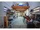 Spacious workshop with shelving and a wooden beam construction overhead for storage at 1948 Spruce Creek Lndg, Port Orange, FL 32128