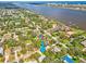 Aerial view of the property in a neighborhood close to the water and city at 20 Warwick Ave, Ormond Beach, FL 32174