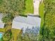An aerial view showing the roof, driveway, and surrounding trees of the property at 20 Warwick Ave, Ormond Beach, FL 32174