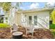 Charming outdoor patio with seating and a fire pit, perfect for relaxation at 20 Warwick Ave, Ormond Beach, FL 32174