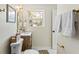 Updated bathroom with a wood vanity, stylish mirrors, and new fixtures for a spa-like experience at 20 Warwick Ave, Ormond Beach, FL 32174