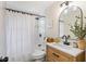 Updated bathroom featuring a sleek, modern vanity, shower with white tile and black fixtures at 20 Warwick Ave, Ormond Beach, FL 32174