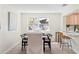Bright dining room with modern table setting and seamless flow into the kitchen at 20 Warwick Ave, Ormond Beach, FL 32174