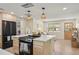 Modern kitchen with stainless steel appliances, white countertops, and breakfast bar at 20 Warwick Ave, Ormond Beach, FL 32174