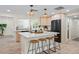 Beautiful modern kitchen with hardwood floors, light cabinets, and a large center island at 20 Warwick Ave, Ormond Beach, FL 32174