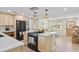 Modern kitchen with stainless steel appliances, white countertops, and breakfast bar at 20 Warwick Ave, Ormond Beach, FL 32174
