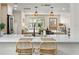 Beautiful kitchen island with quartz countertops and barstool seating, perfect for casual dining at 20 Warwick Ave, Ormond Beach, FL 32174