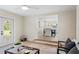 Comfortable living area leading to dining room with wooden floors and access to the outdoors at 20 Warwick Ave, Ormond Beach, FL 32174