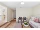 Inviting living area with stylish decor, wood floors, and a seamless transition into the kitchen at 20 Warwick Ave, Ormond Beach, FL 32174