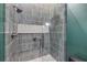 Tile shower with overhead and handheld showerheads at 213 Cedar Ave, New Smyrna Beach, FL 32169