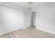 Bedroom featuring neutral walls, wood-look floors and a large closet at 2211 Brian Ave, South Daytona, FL 32119